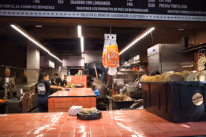 Fresh corn tortillas being produced.