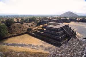 A view of the surrounding vegetation hints at how all the pyramids looked when they were rediscovered in the modern era.