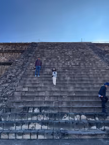 On the steps of the Adosada, that hides the view of the front face of the Temple of the Feathered Serpent