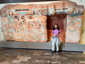 Tejas in front of a painted façade