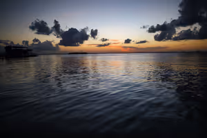 Sunset lighting up the clouds on the horizon, above the Nichupté Lagoon.