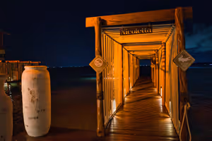 Another view of the pier and the lights of a boat arriving