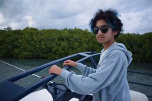 Aarav taking a turn at the top of the boat.