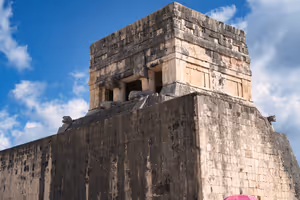 The top of the Temple, from the side of the Ball court. A pair of downward facing snakes guard the entrance.