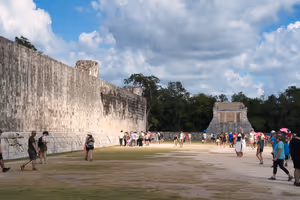 The game ends when they were able to get a ball through that hoop in the wall.