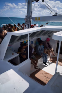 The majority of folks were seated on the bow of the catamaran.